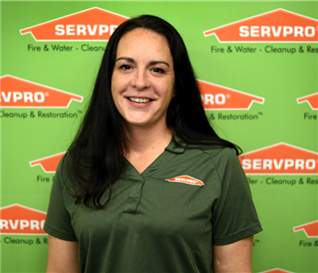 image of female sitting in front of SERVPRO® backdrop