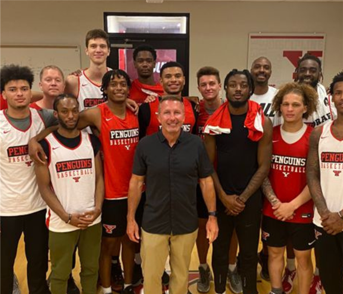 SERVPRO owner, Jim Dobson, with YSU men's basketball team