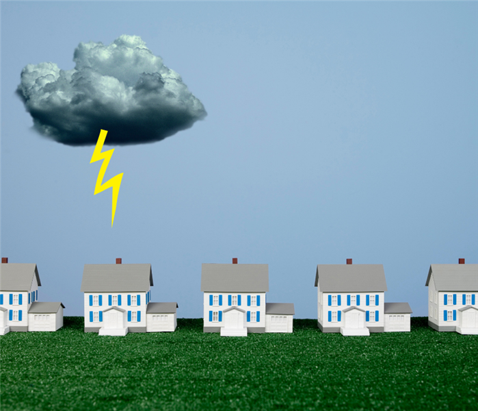 picture shows a lightning bolt coming out of a cloud striking a house