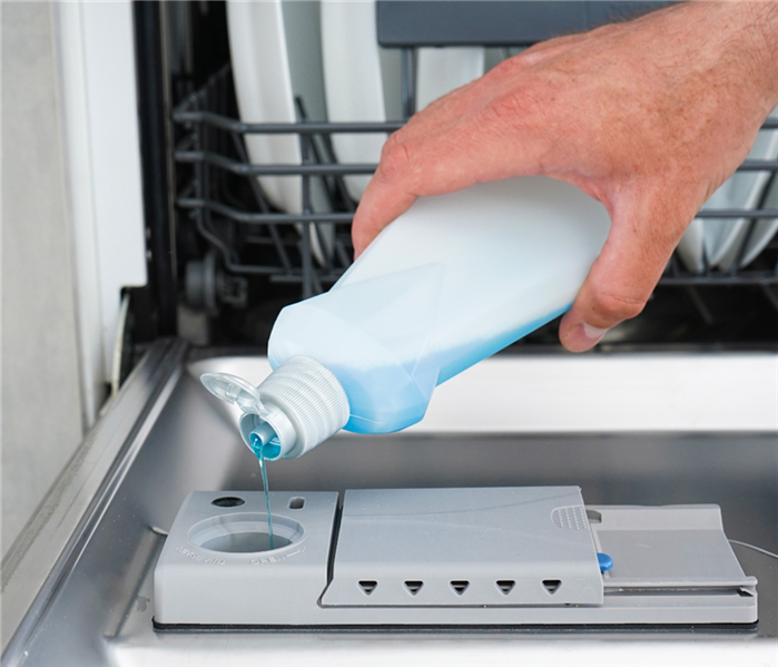 filling dishwasher with dish soap